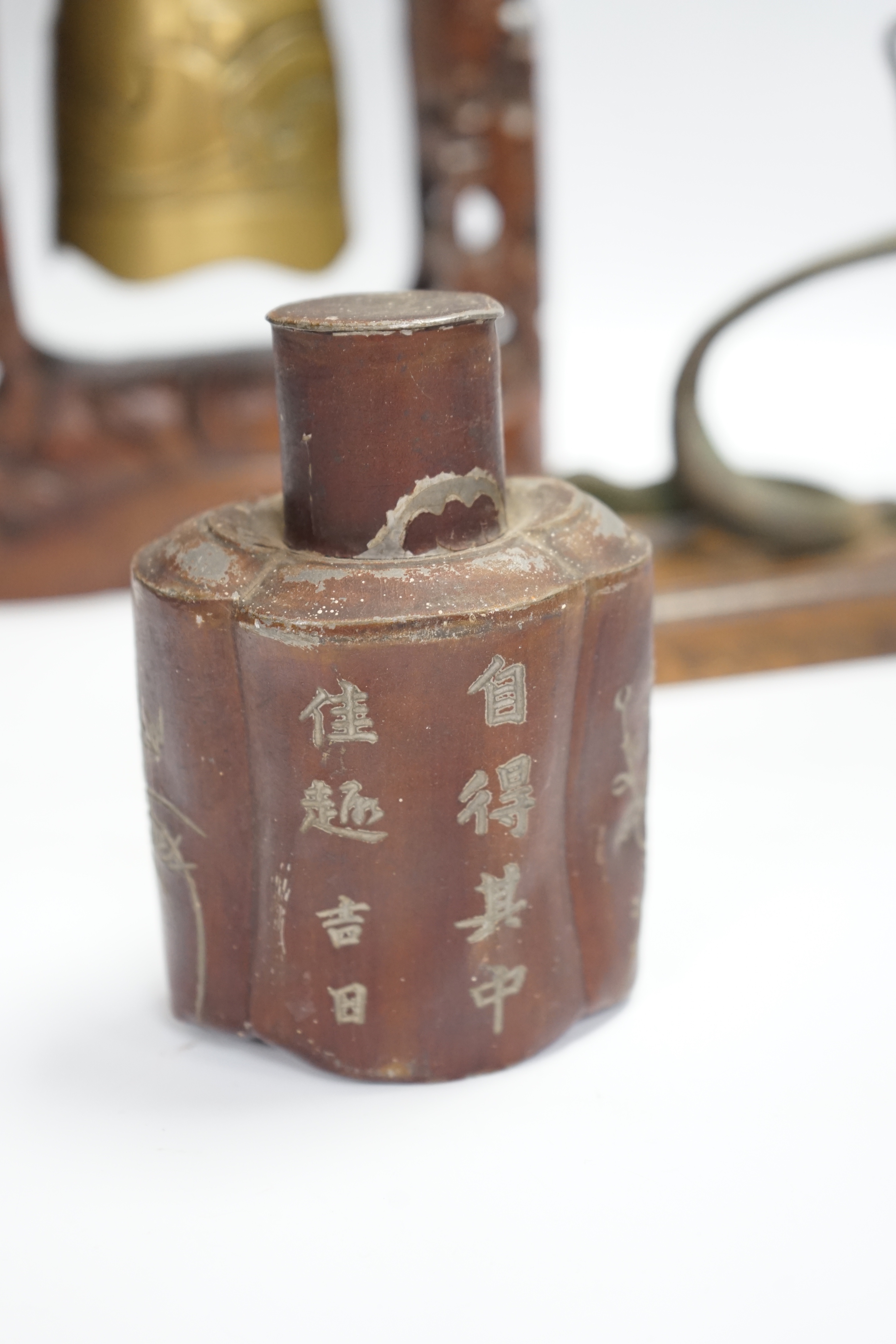 A Chinese table bell, pewter tea canister and an Indian ‘cobra’ hook, bell in frame 34.5cm high